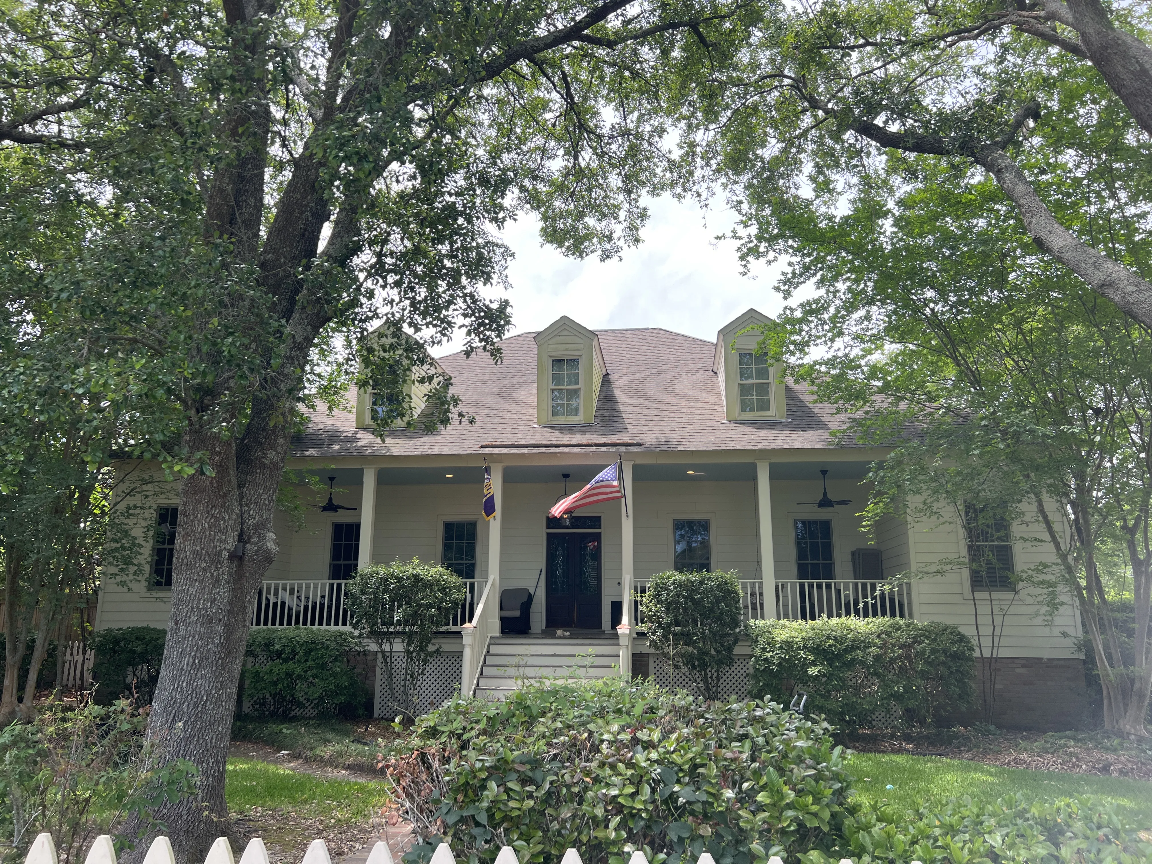 Roof before replacement in Madisonville Louisiana — damaged shingles