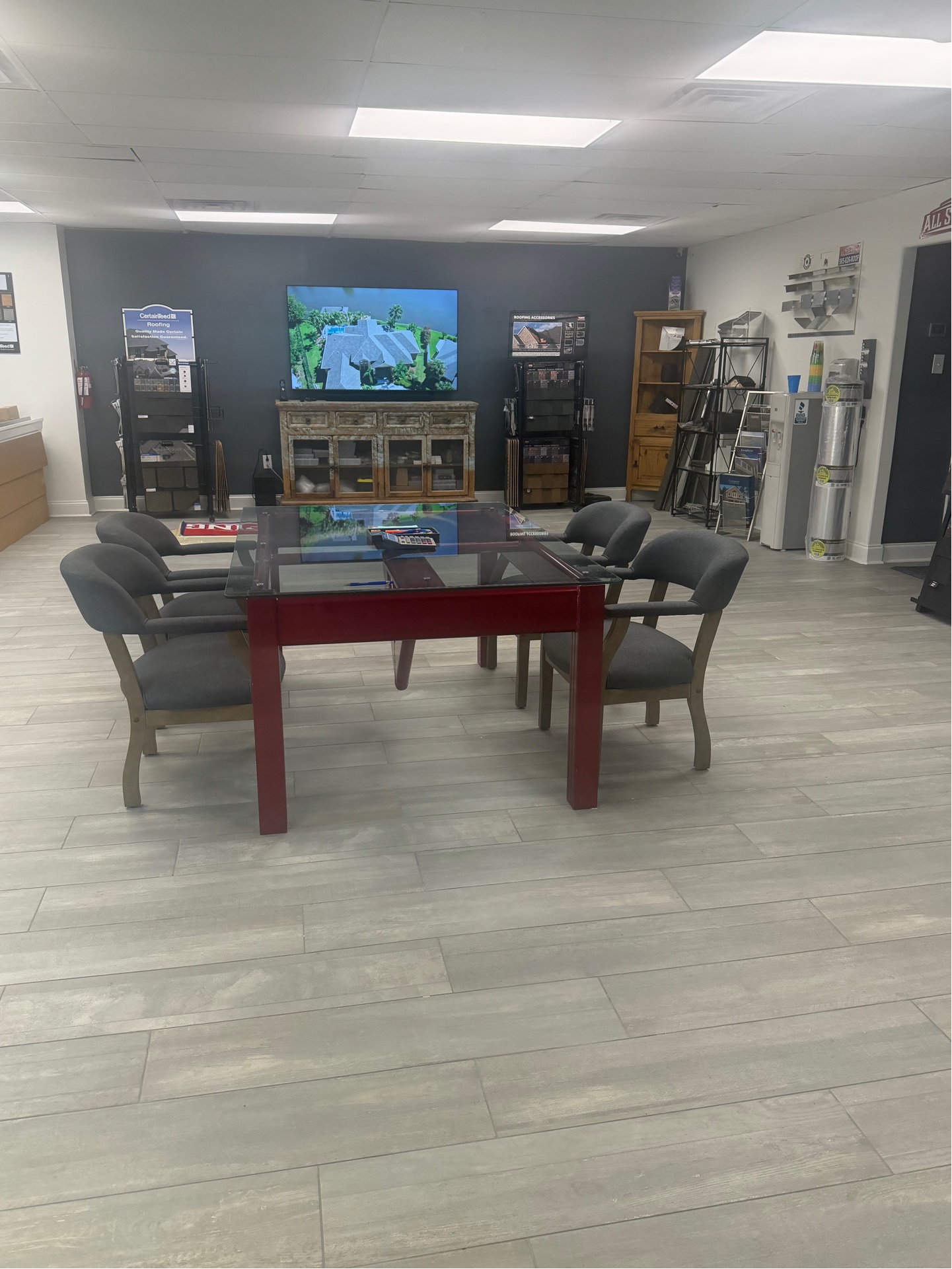 All Star Roofing showroom consultation area with CertainTeed display